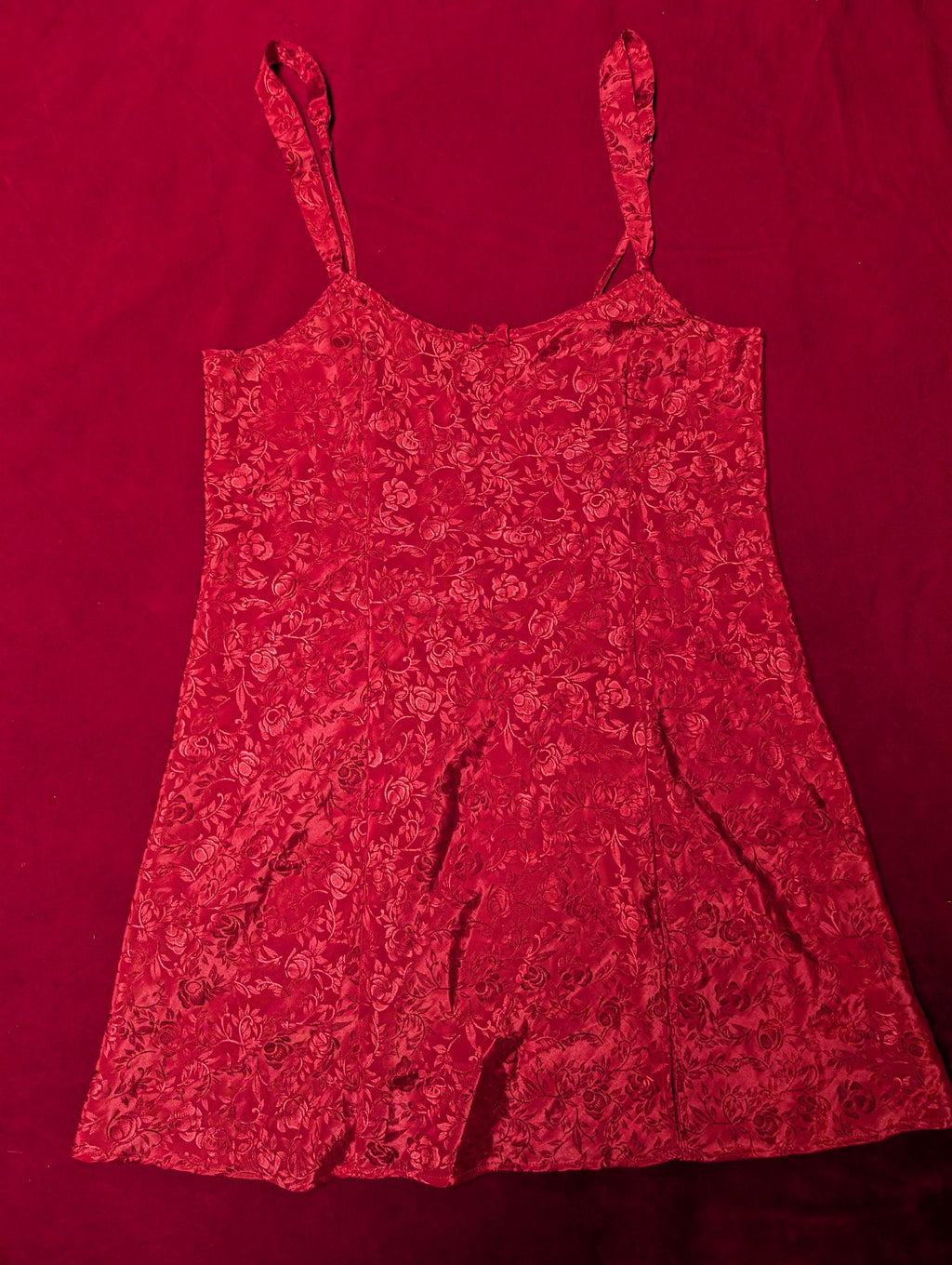 Red floral dress on a matching red background