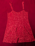 Red floral dress on a matching red background